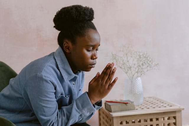 Woman praying in gratitude