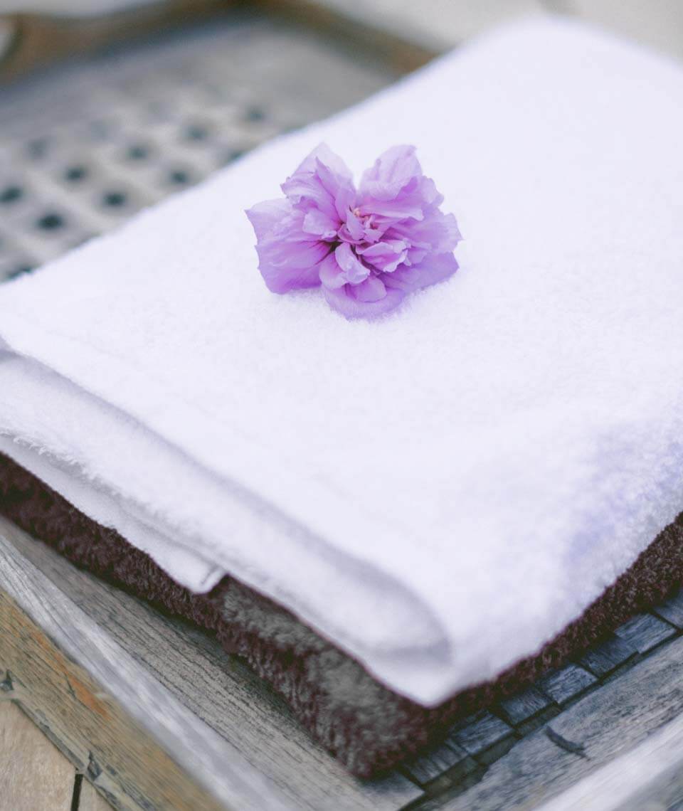 spa-2-1 purple flower on white towel